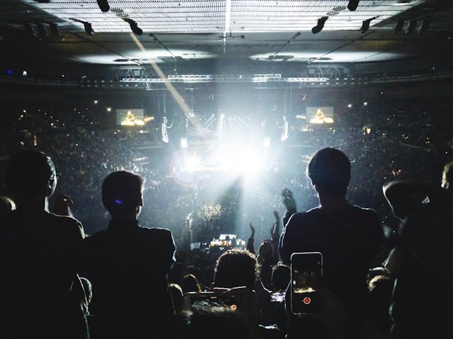 a-group-of-people-standing-in-front-of-a-crowd