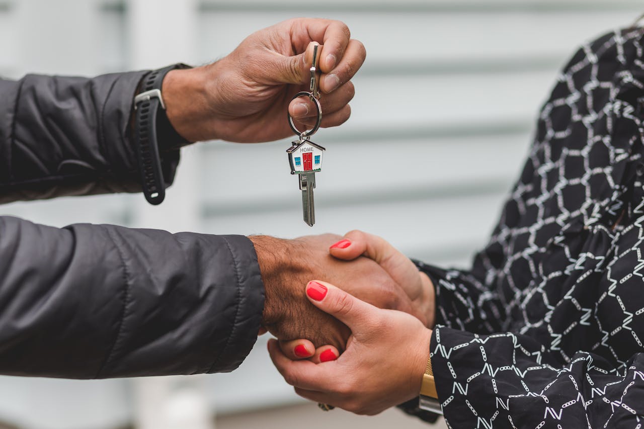 person-holding-silver-key